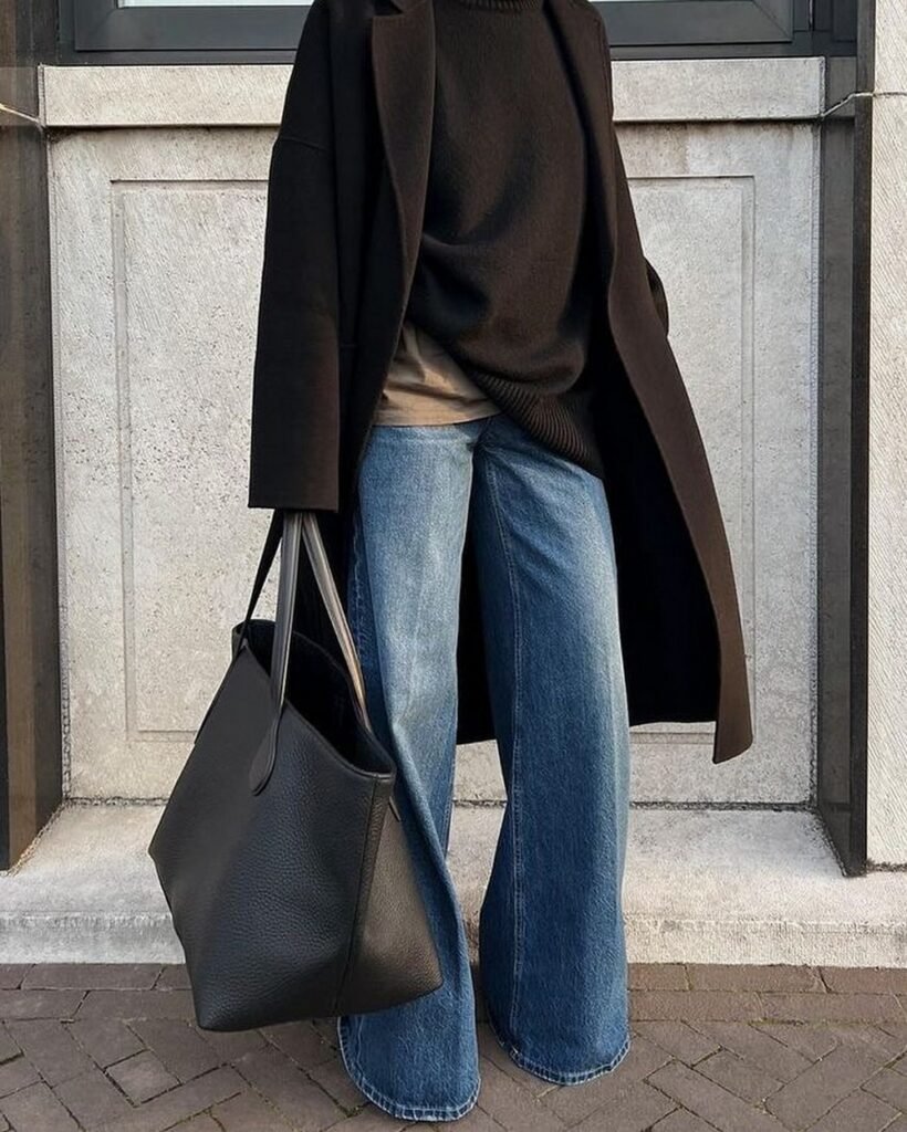 Black Long Coat + Black Sweater + Wide-Leg Jeans + Black Tote Bag