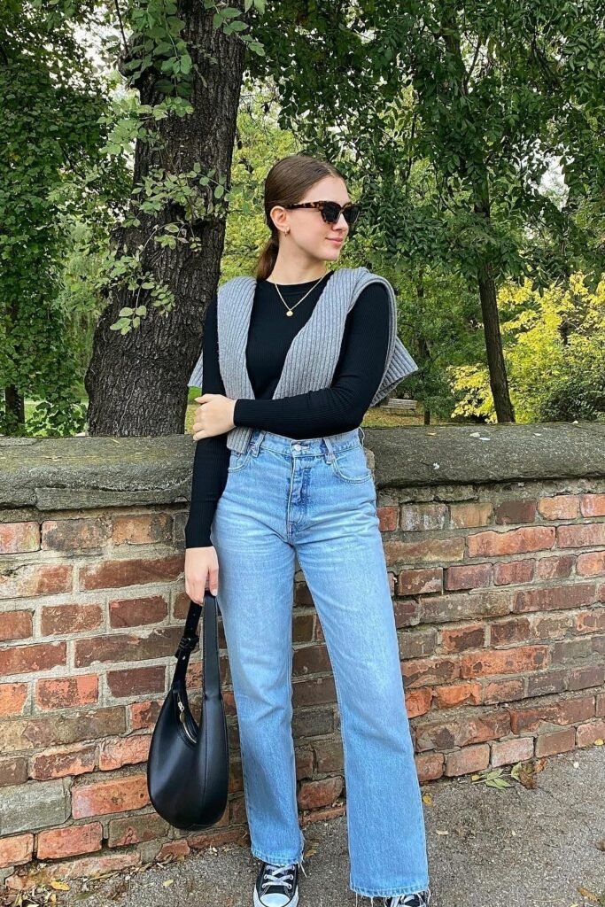 Black Long-Sleeve Top + Grey Knit Vest Worn as Scarf + Light Wash Straight Jeans + Black Sneakers