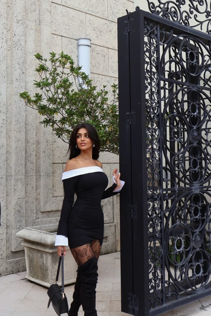 Black Off-The-Shoulder Mini Dress (with White Trim) + Black Lace Tights/Stockings + Black Suede Thigh-High Boots