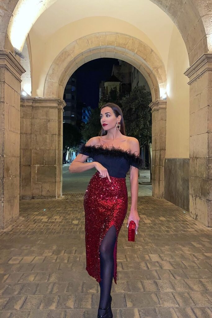 Black Off-the-Shoulder Feather Top + Red Sequin Slit Midi Skirt + Black Tights and Heels