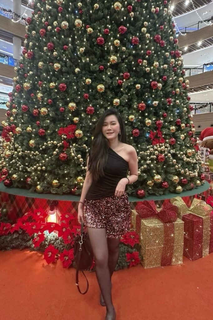 Black One-Shoulder Top + Burgundy Sequin Shorts + Black Tights + Black Handbag