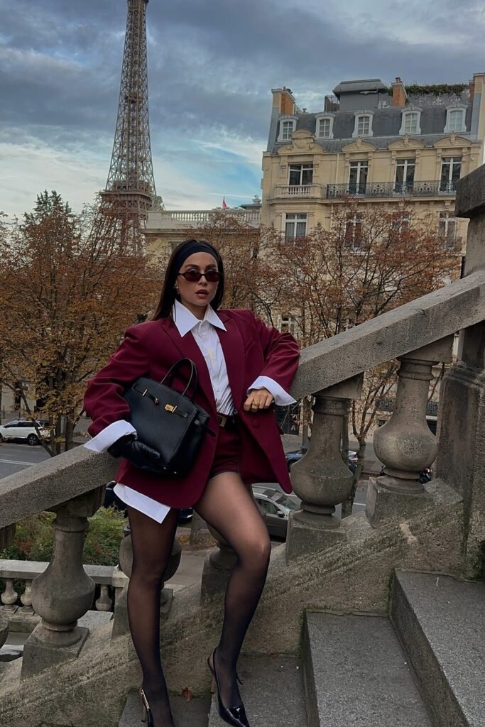 Black Oversized Blazer + Black Sheer Top + Light Blue Straight-Leg Jeans + Black Loafers