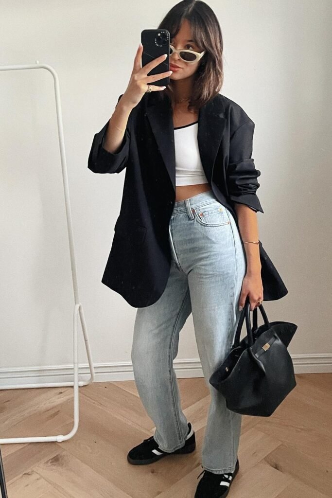 Black Oversized Blazer + White Cropped Bra Top + Light Wash Straight-leg Jeans + Black Sneakers
