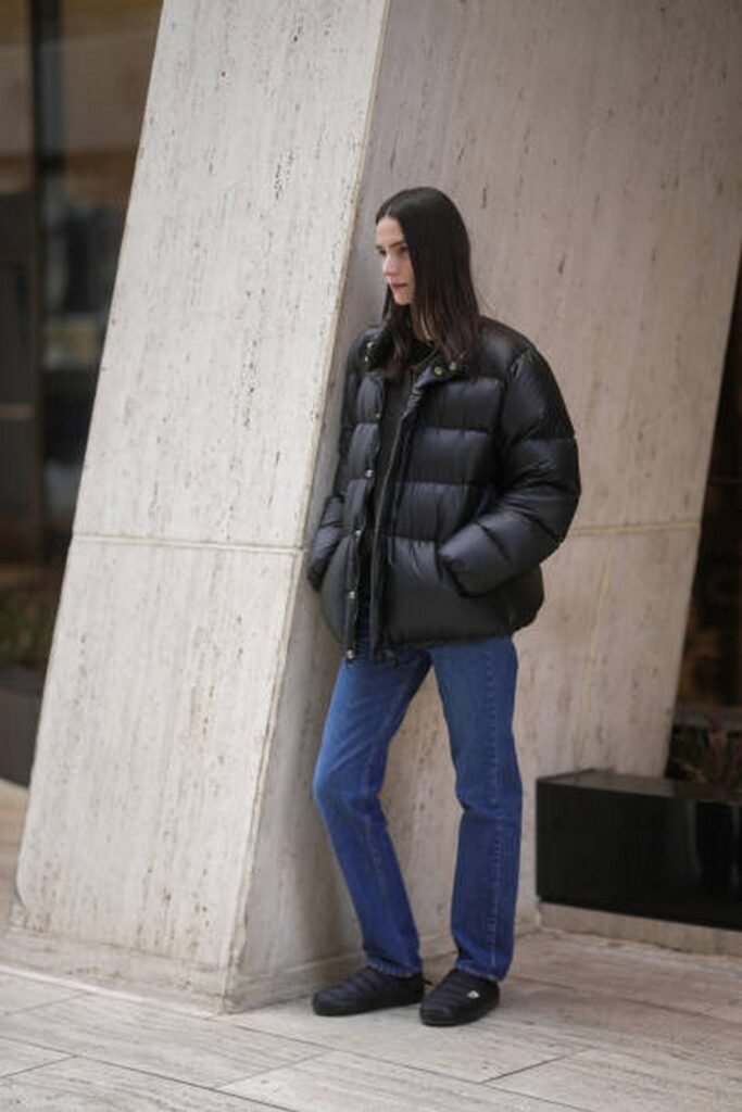 Black Puffer Jacket + Dark Blue Straight Leg Jeans + Black Slip-On Shoes