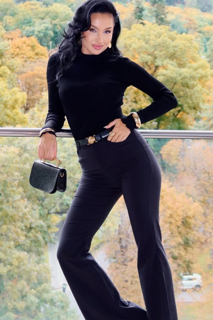Black Ribbed Turtleneck + Black Flared Trousers + Gold Buckle Belt + Black Glitter Handbag