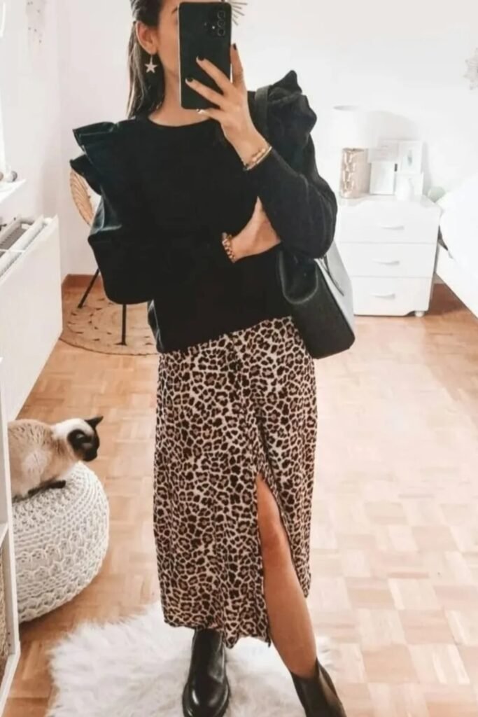Black Ruffled Shoulder Sweater + Leopard Print Midi Skirt with Slit + Black Lug Sole Ankle Boots + Black Shoulder Bag