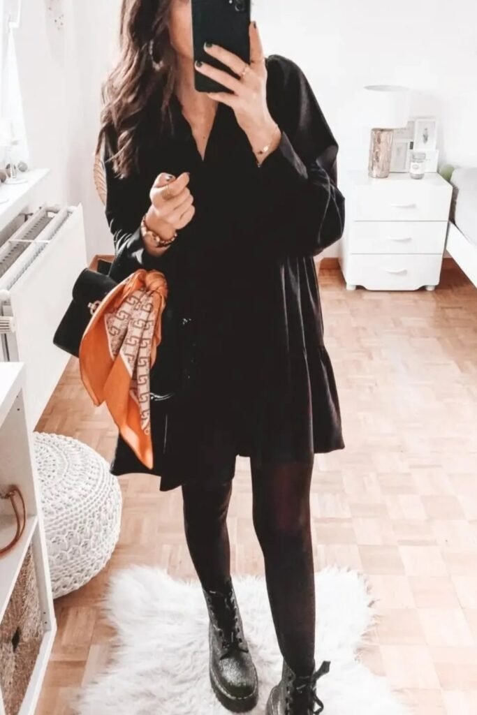 Black Shirt Dress + Sheer Black Tights + Black Combat Boots + Black Shoulder Bag with Orange Scarf Accent