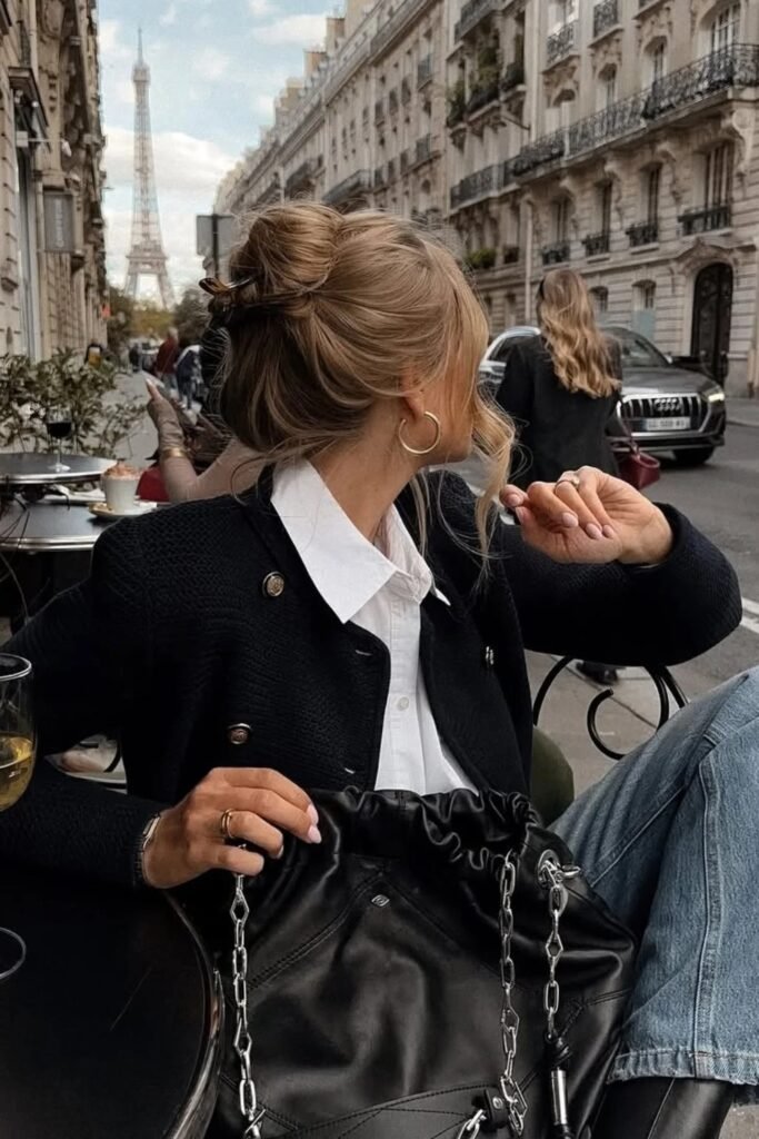 Black Tweed/Textured Cropped Jacket with Gold Buttons + White Button-Down Shirt + Medium Wash Straight-Leg Jeans + Black Drawstring Bag