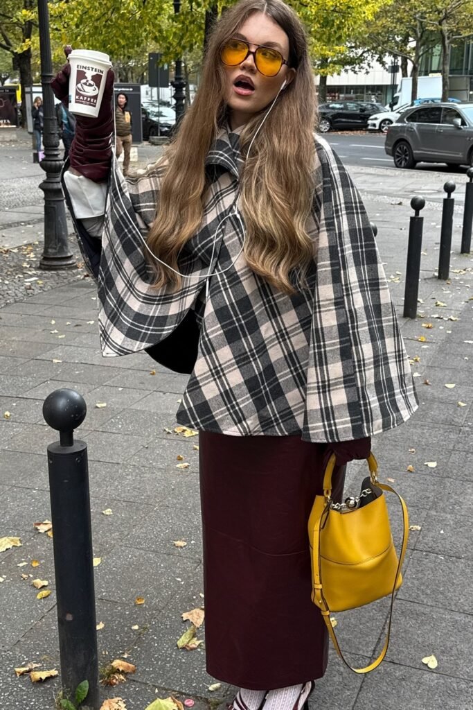 Black and White Plaid Cape + Burgundy Leather Maxi Skirt + Burgundy Gloves + Yellow Bucket Bag