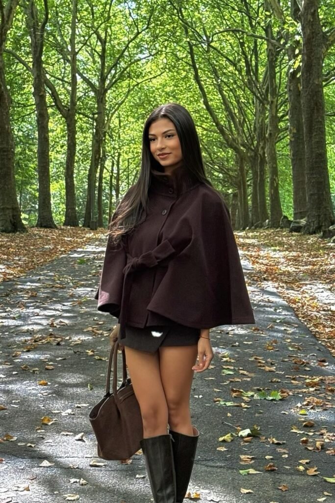 Brown Cape Coat + Black Mini Skirt + Black Knee-High Boots + Brown Tote Bag