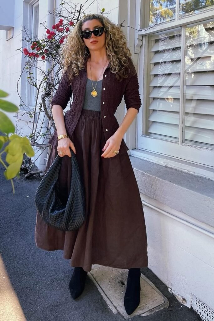 Brown Cardigan + Grey Tank Top + Brown Maxi Skirt + Black Boots + Woven Black Bag