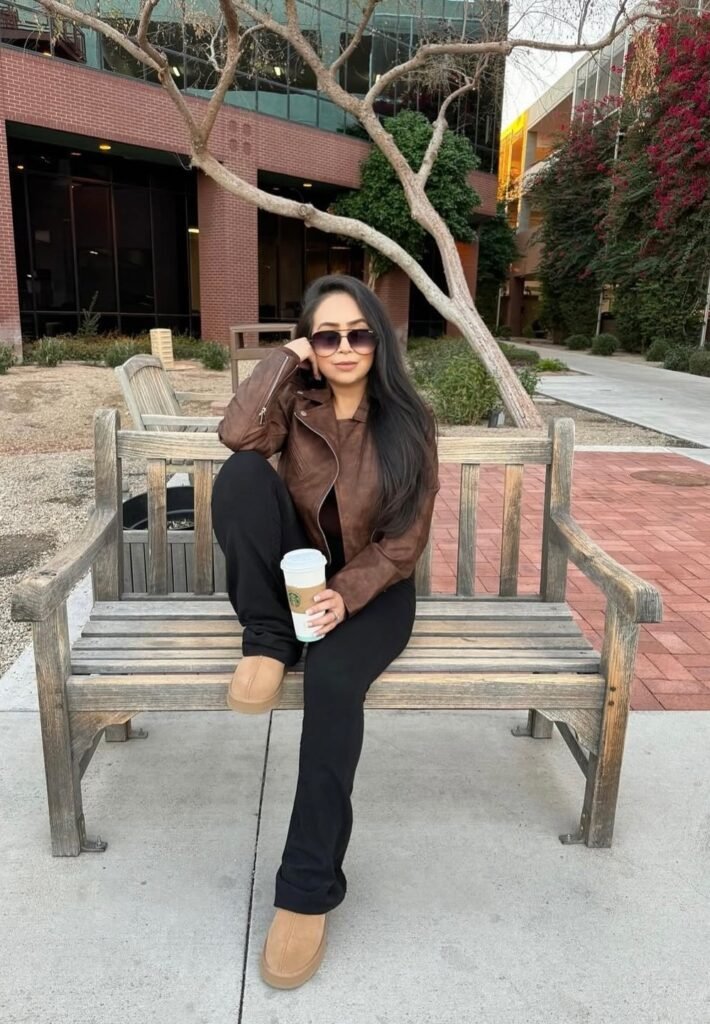Brown Leather Jacket + Black Top + Black Flared Pants + Tan Slippers + Sunglasses
