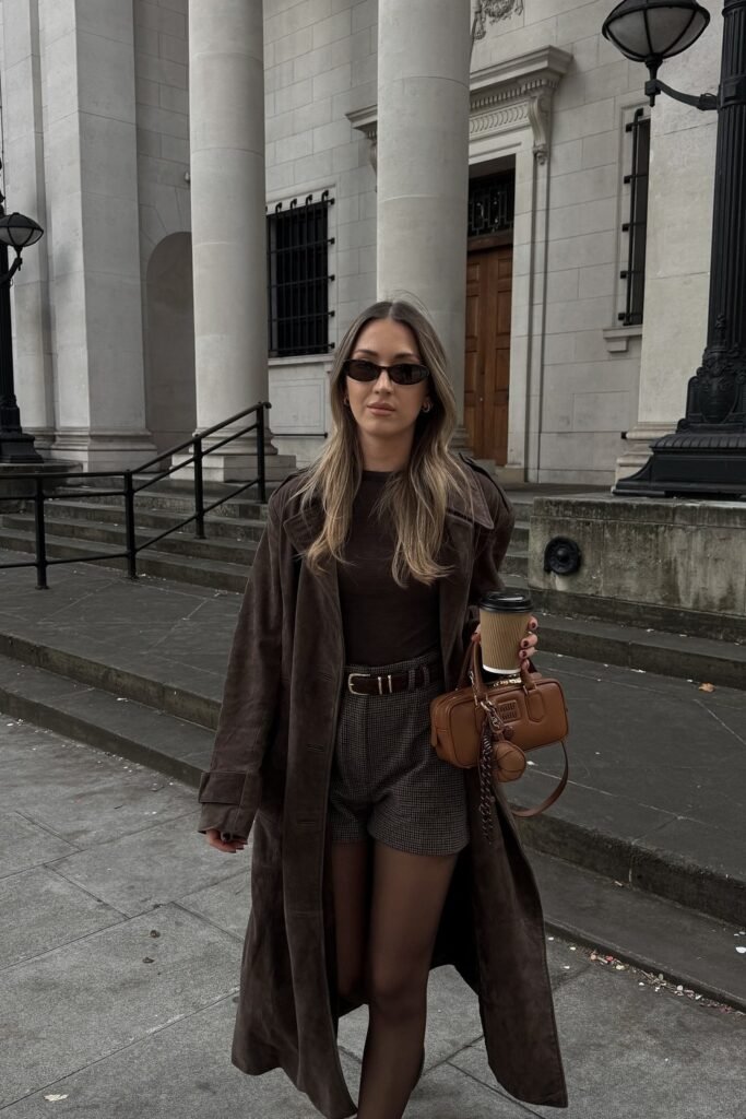 Brown Long Suede Trench Coat + Brown Top + Plaid Shorts + Black Tights + Brown Mini Bag