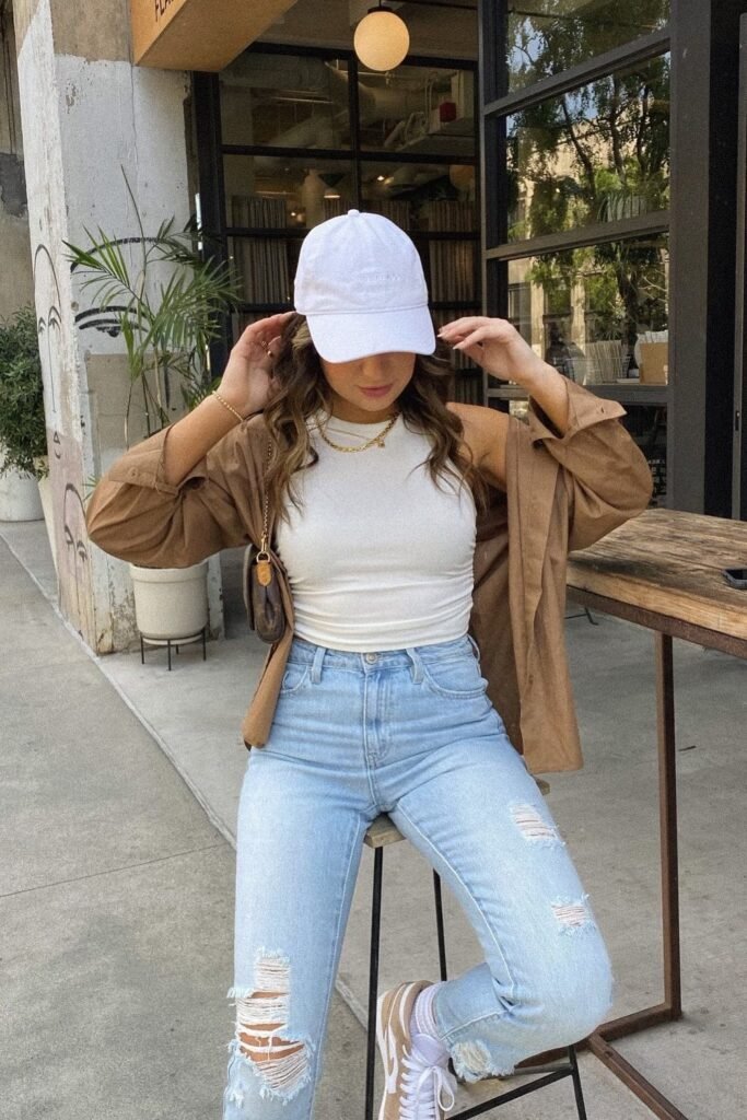 Brown Overshirt + White Crop Tank Top + Ripped Light Wash Skinny Jeans + White Baseball Cap