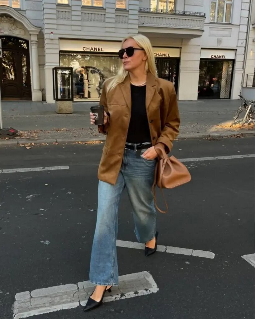 Brown Oversized Blazer + Black T-Shirt + Wide Leg Blue Jeans + Black Pointed Toe Heels + Brown Drawstring Bag