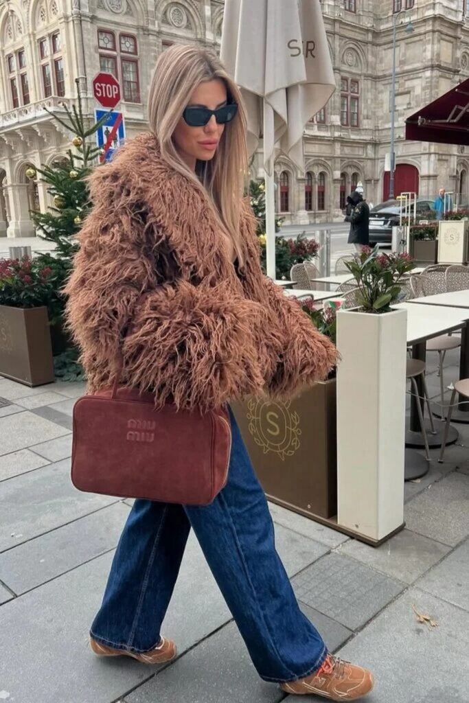 Brown Shaggy Coat + Dark Blue Flared Jeans + Brown Sneakers + Brown Handbag