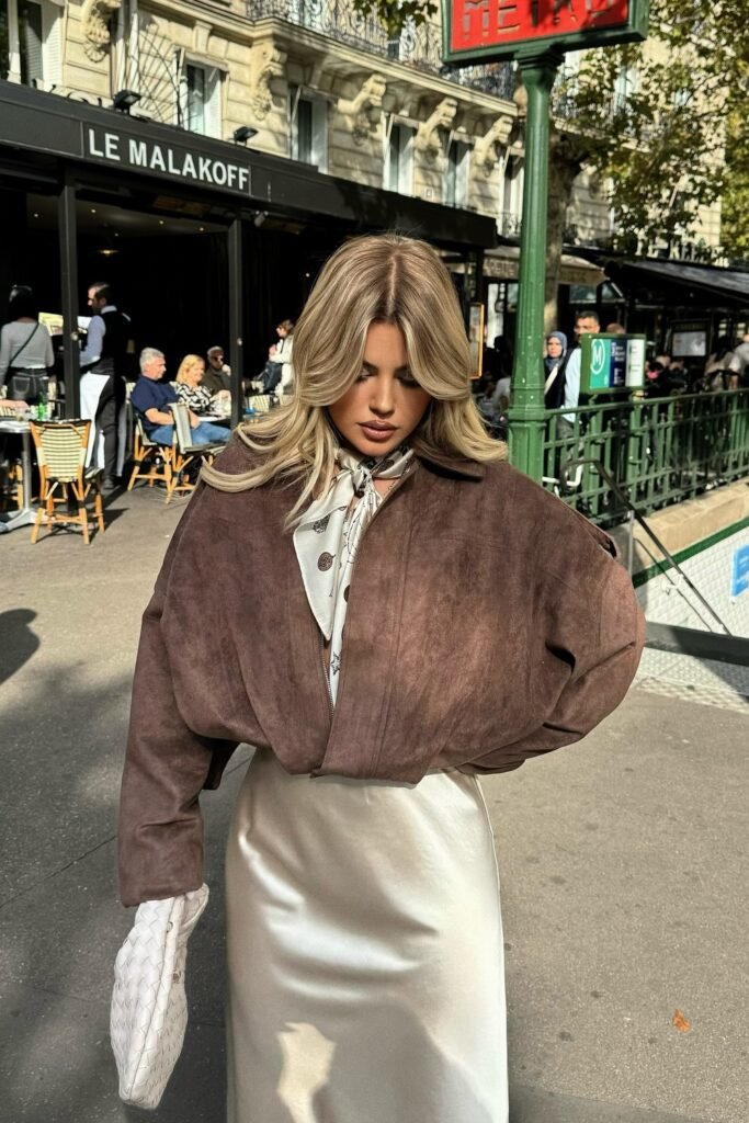 Brown Suede Cropped Jacket + White Satin Maxi Skirt + Printed Silk Scarf + Beige Woven Handbag