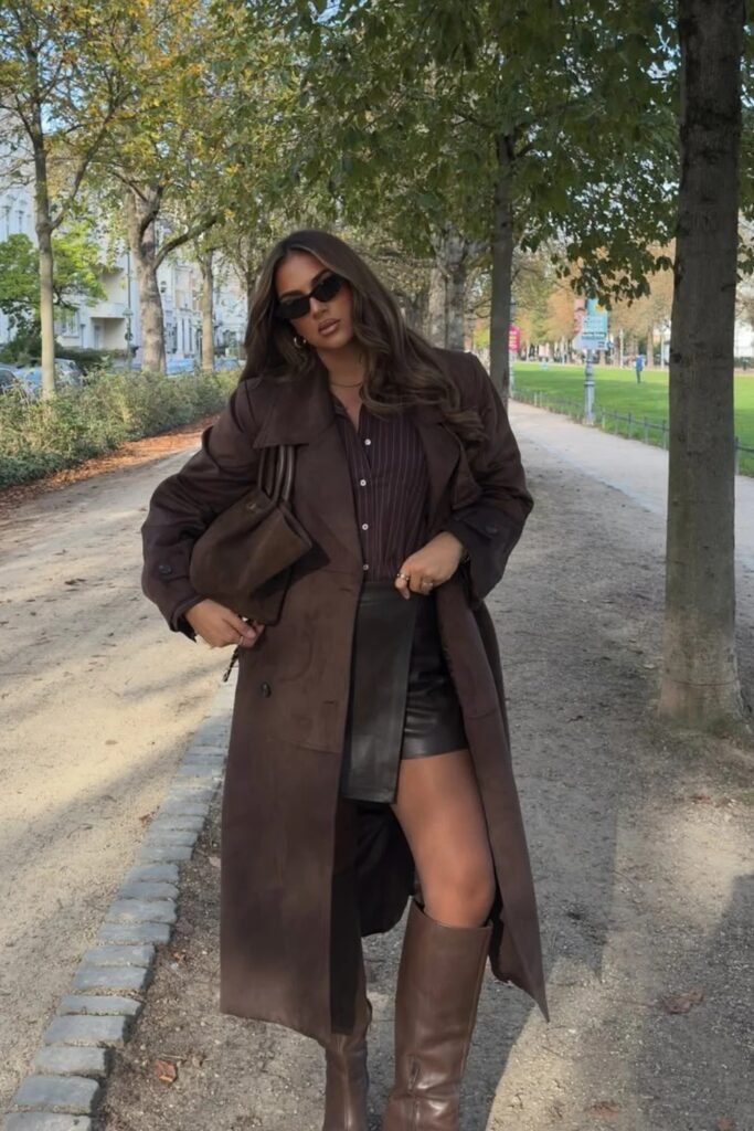 Brown Suede Trench Coat + Striped Button-Up Shirt + Leather Mini Skirt + Brown Knee Boots