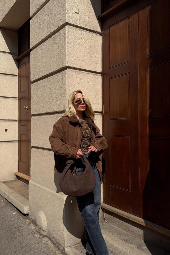 Brown Suede/Corduroy Jacket + Animal Print Top + Dark Wash Jeans + Large Brown Shoulder Bag
