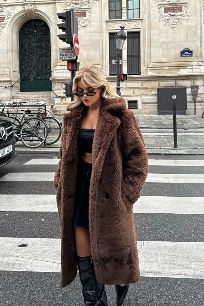 Brown Teddy Coat + Black Bandeau Top + Black Mini Skirt + Black Over-the-Knee Boots + Cat-Eye Sunglasses