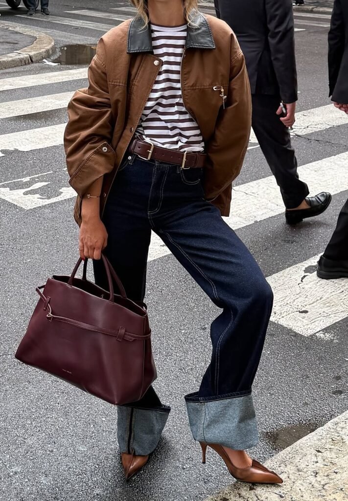 Brown Utility Jacket with Black Collar + Brown and White Striped T-Shirt + Dark Wash Cuffed Jeans + Brown Pointed Toe Heels + Burgundy Tote Bag