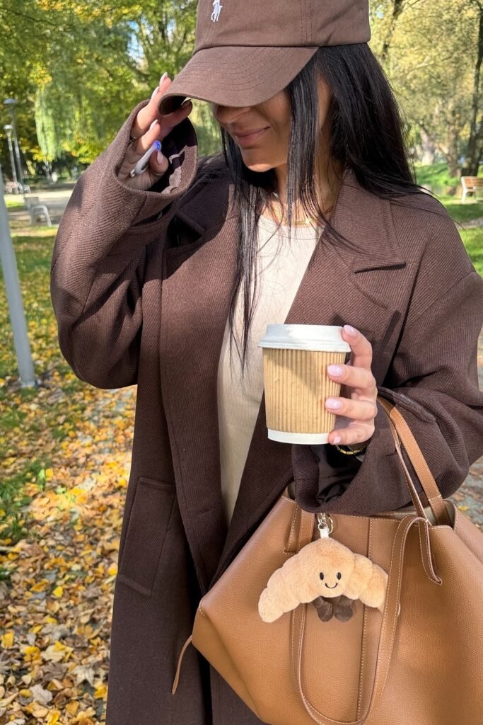 Brown Wool Coat + Light Beige Top + Brown Baseball Cap