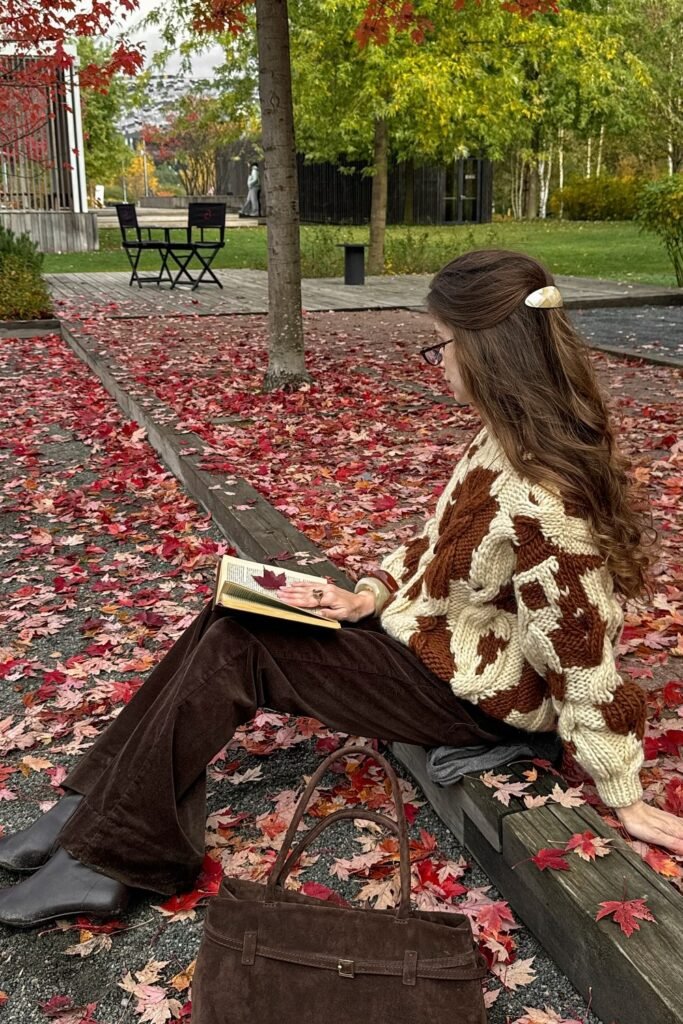 Brown and Cream Cow-Print Sweater + Brown Corduroy Flared Trousers + Dark Brown Boots + Brown Suede Bag