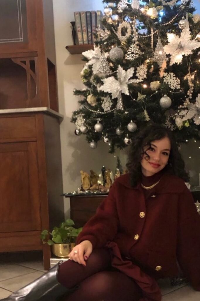 Burgundy Cropped Jacket + Burgundy Tights + Black Knee-High Boots + Gold Chain Necklace