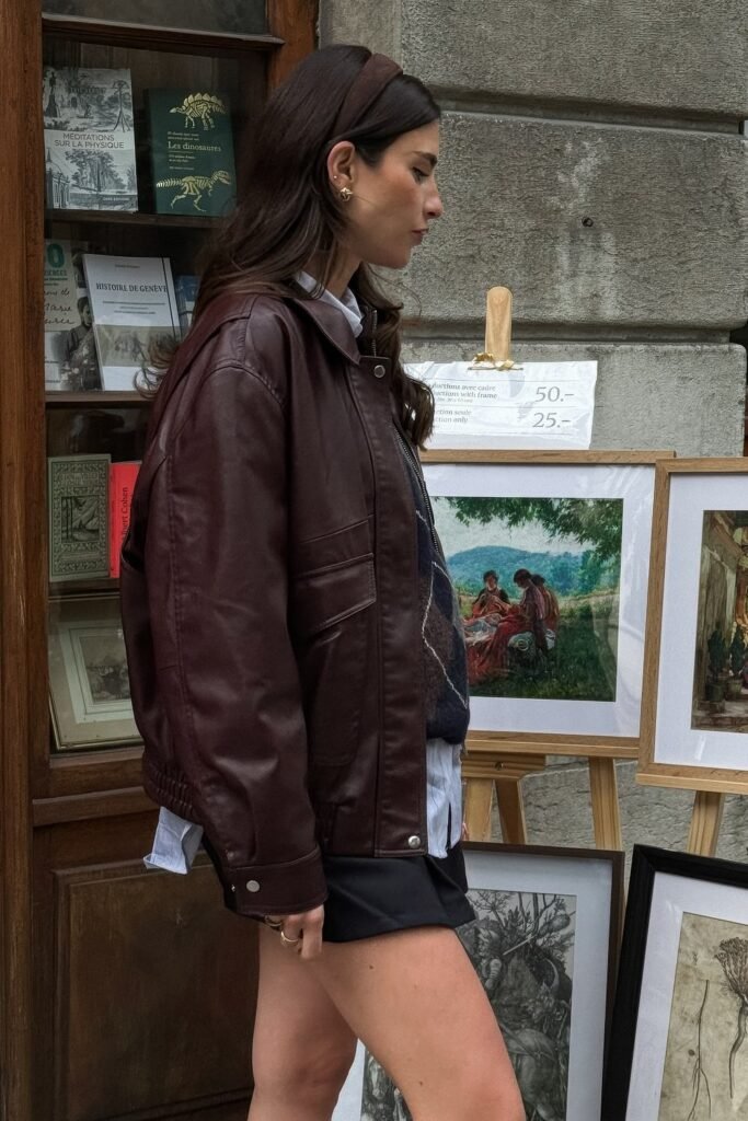 Burgundy Leather Bomber Jacket + Striped Vest + White Collared Shirt + Black Mini Skirt