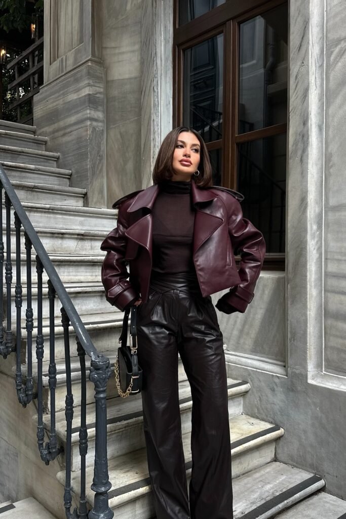 Burgundy Leather Jacket + Black Sheer Turtleneck + High-Waisted Leather Pants + Black Chain Bag