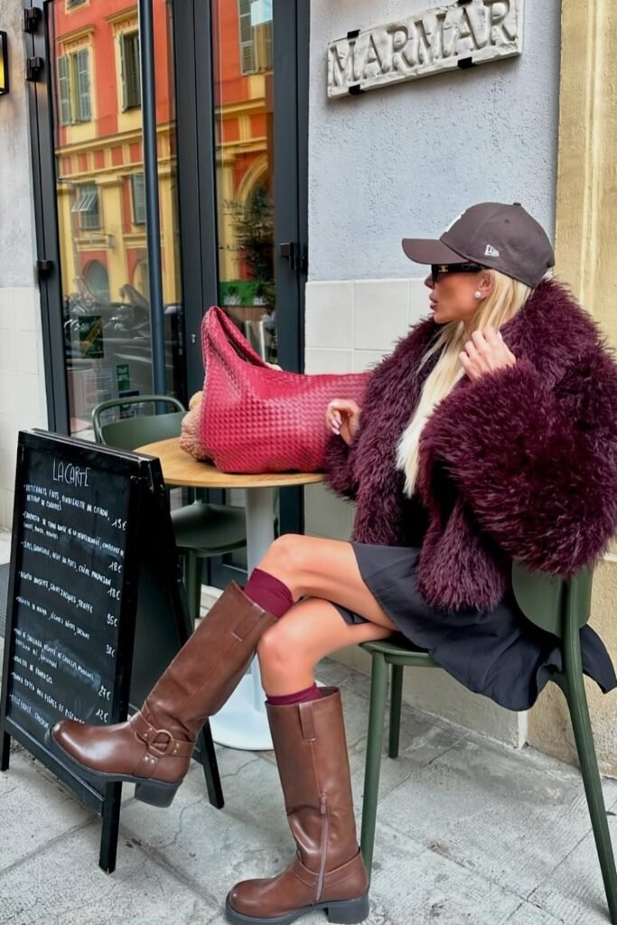 Burgundy Shaggy Faux Fur Coat + Black Mini Dress + Brown Knee-High Boots + Red Tote Bag