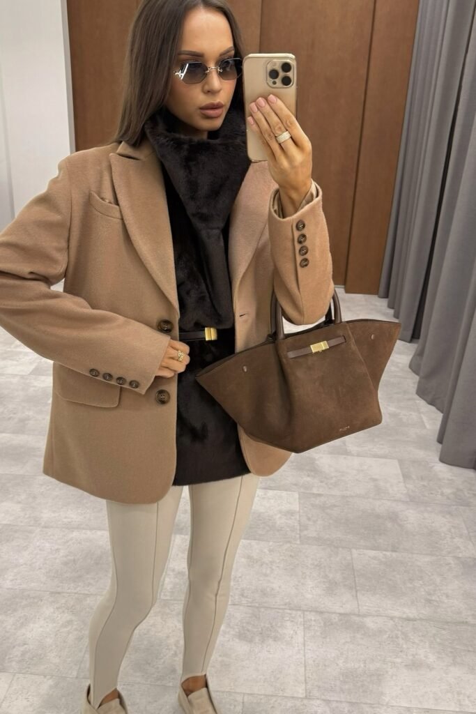 Camel Blazer + Black Faux Fur Vest + Cream Stirrup Leggings + Beige Loafers + Brown Suede Handbag