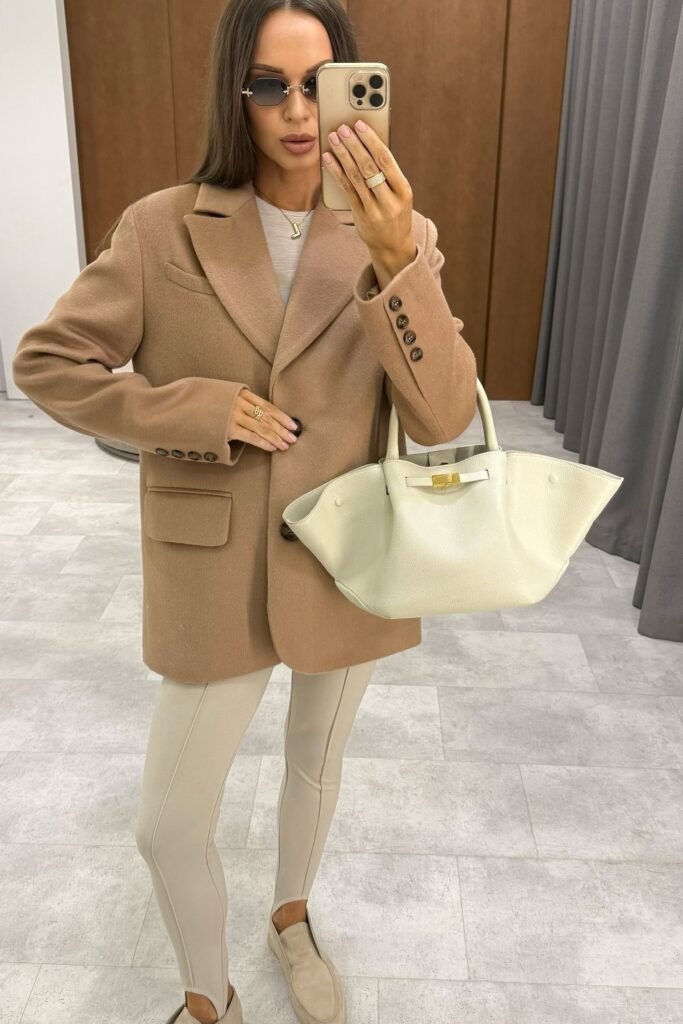 Camel Trench Coat + White Turtleneck Sweater + White Trousers + Brown Leather Handbag