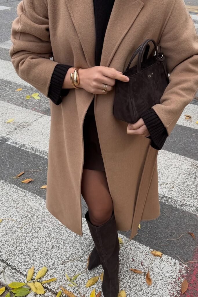 Camel Wrap Coat + Black Sweater + Black Shorts + Black Tights + Dark Brown Knee-High Boots