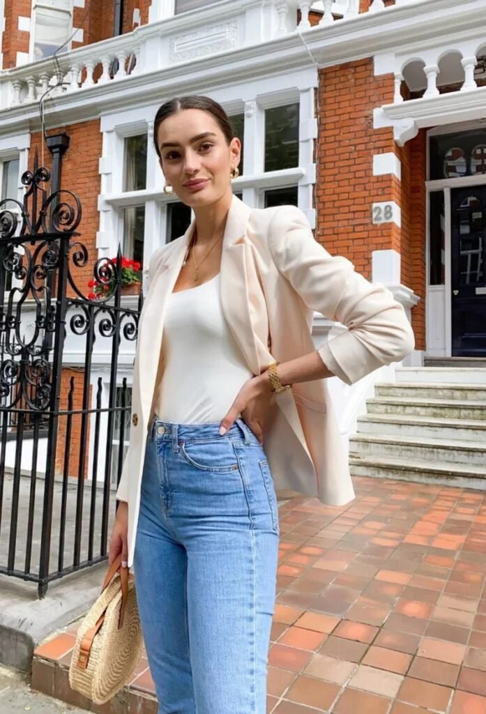 Cream Blazer + White Bodysuit + High-Waisted Blue Skinny Jeans + Straw Bag