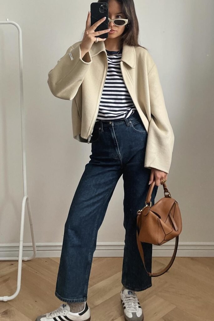 Cream Cropped Jacket + Navy Striped T-shirt + Dark Wash Straight-leg Jeans + Tan Handbag
