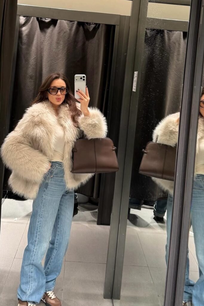 Cream Faux Fur Coat + Light Wash Wide-Leg Jeans + Brown and White Sneakers