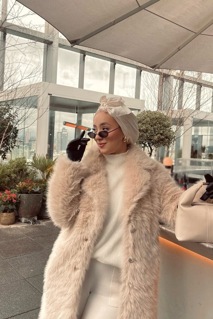 Cream Faux Fur Coat + White Turtleneck Sweater + White Satin Turban