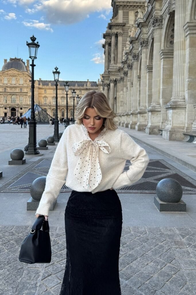 Cream Sweater with Polka Dot Bow + Black Lace Maxi Skirt + Black Structured Handbag