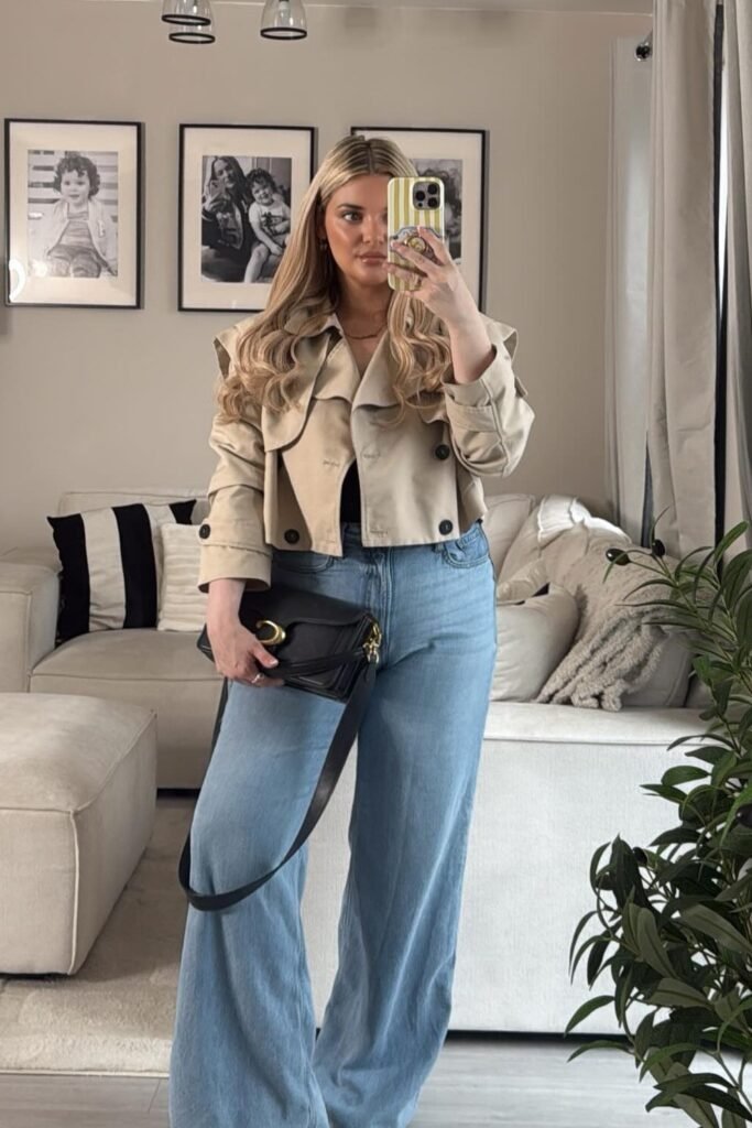Cropped Beige Trench Jacket + Black Top + Light Wash Wide-Leg Jeans + Black Shoulder Bag