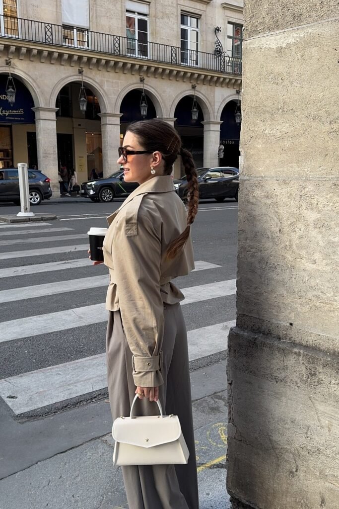 Cropped Beige Trench Jacket + Grey Wide-Leg Trousers + White Top-Handle Bag