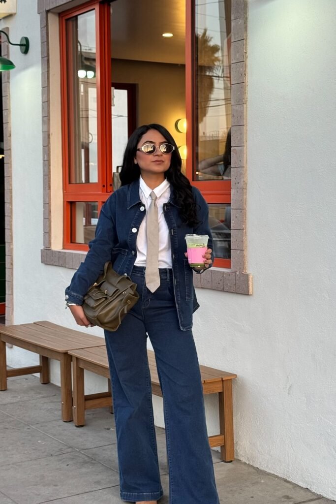 Dark Denim Jacket + White Collared Shirt + Tan Tie + Dark Wash Wide Leg Jeans + Olive Green Satchel Bag