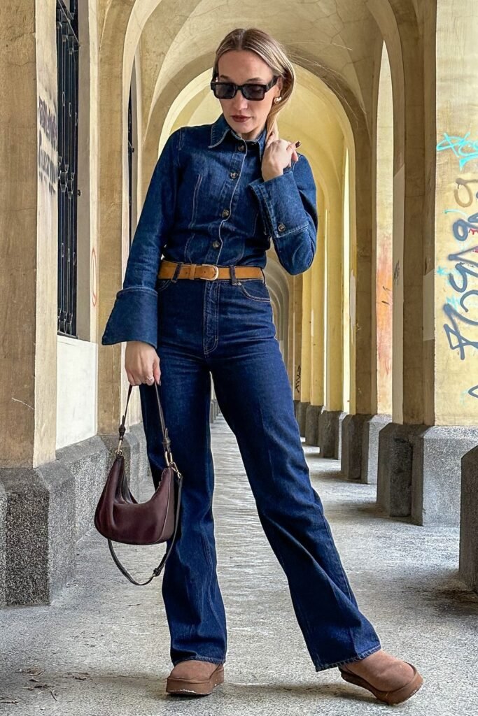 Denim Button-Up Shirt + Dark Wash Flared Jeans + Tan Belt + Brown Platform Mules + Burgundy Mini Hobo Bag