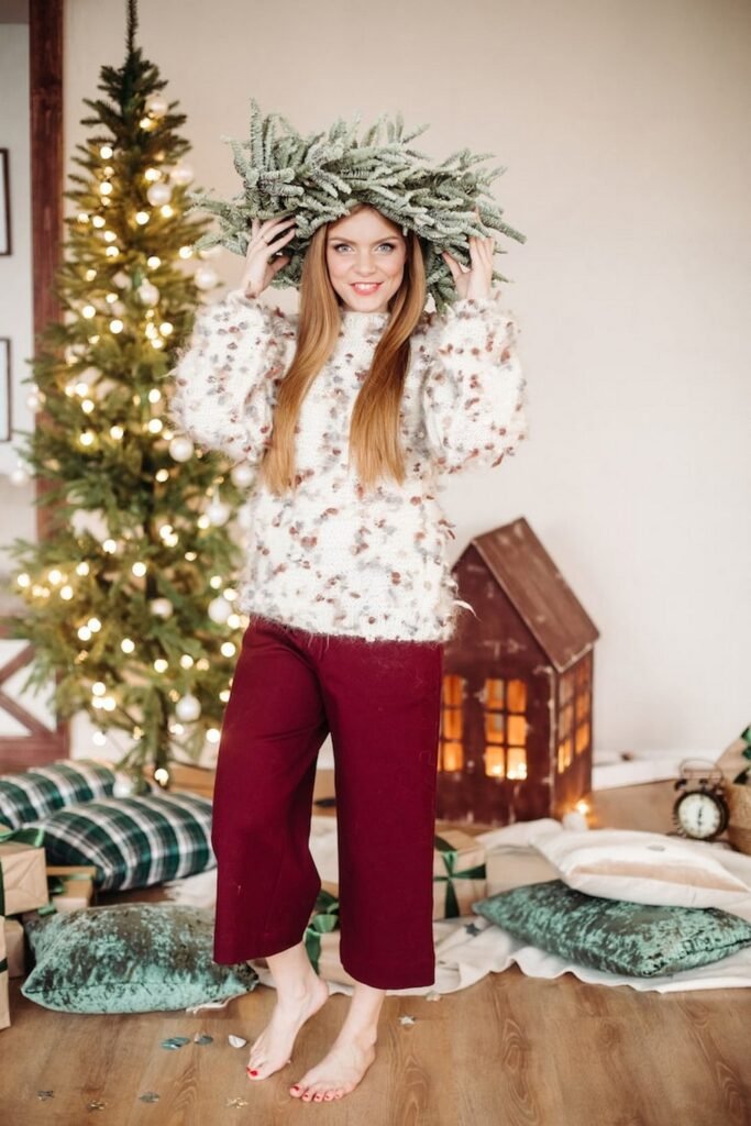 Fluffy Floral Sweater + Maroon Wide-Leg Cropped Trousers + Evergreen Wreath Headpiece