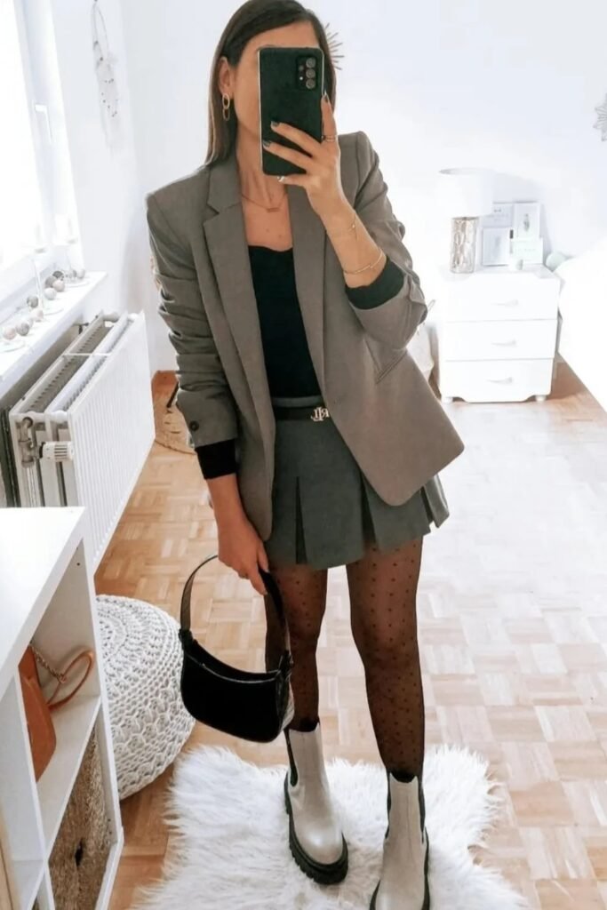 Gray Blazer + Black Tank Top + Gray Pleated Mini Skirt + Black Polka Dot Tights + Light Gray/White Lug Sole Boots