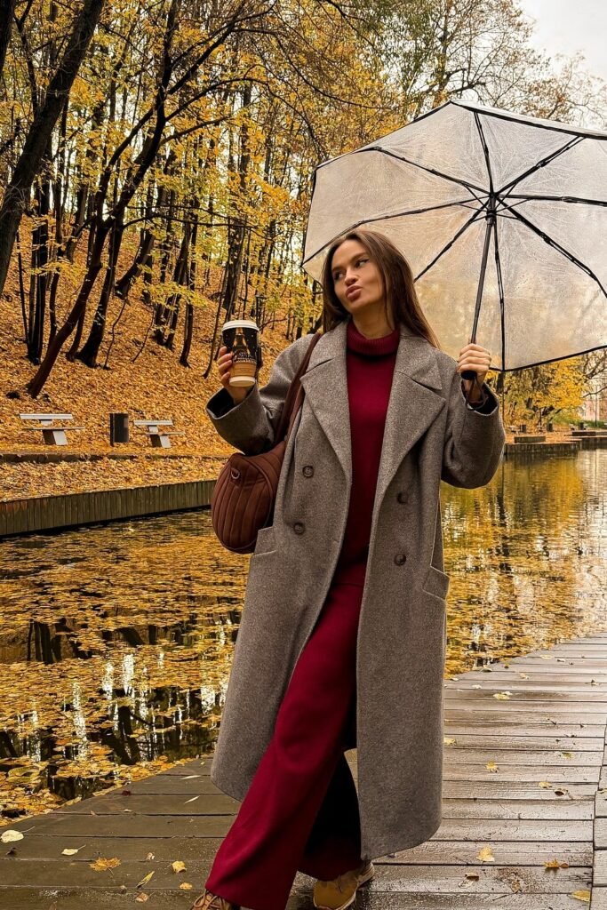 Gray Long Coat + Red/Burgundy Turtleneck Sweater + Matching Wide-Leg Trousers + Brown Quilted Shoulder Bag