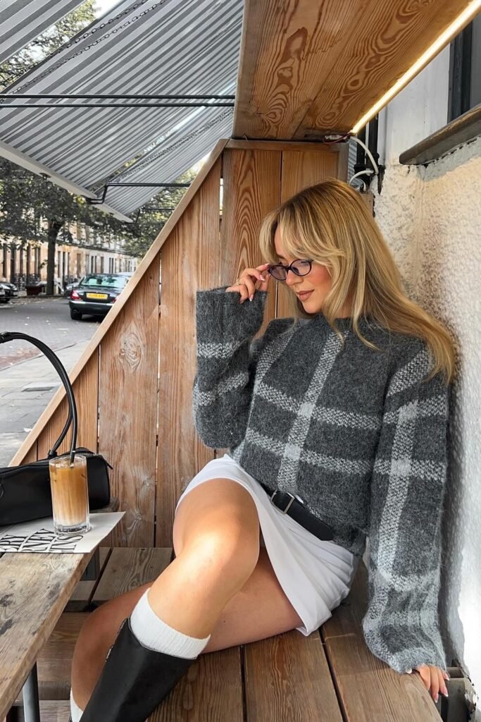 Gray Plaid Knit Sweater + White Pleated Mini Skirt + Black Belt + White Mid-Calf Socks + Black Knee-High Boots