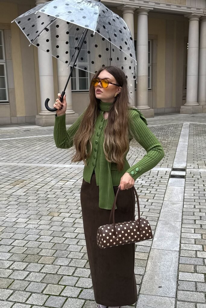 Green Ribbed Cardigan + Green Tie-Neck Scarf + Brown Maxi Skirt + Polka Dot Umbrella + Polka Dot Shoulder Bag