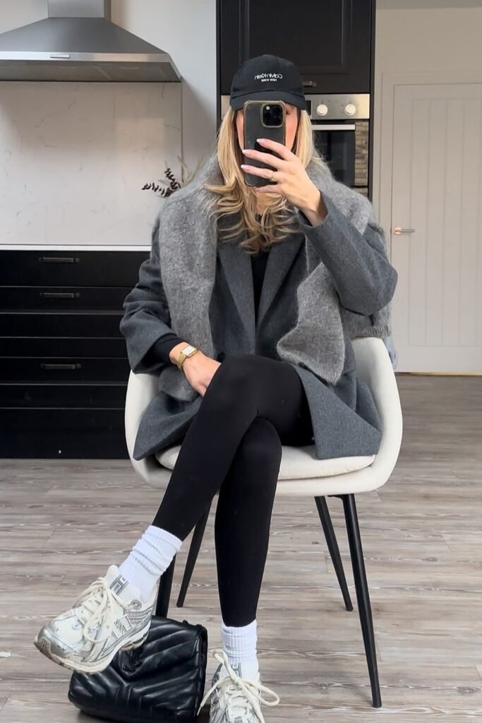 Grey Coat + Grey Scarf + Black Top + Black Leggings + White/Silver Sneakers + Black Cap