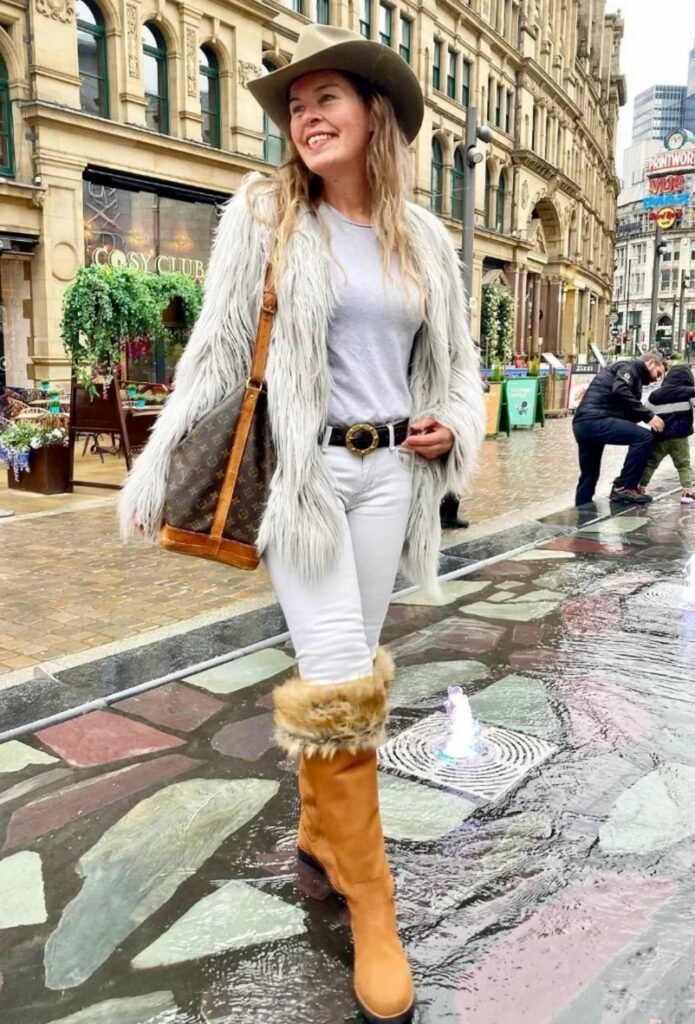 Grey Faux Fur Coat + Grey T-shirt + White Skinny Jeans + Fur-Trimmed Tan Boots + Cowboy Hat
